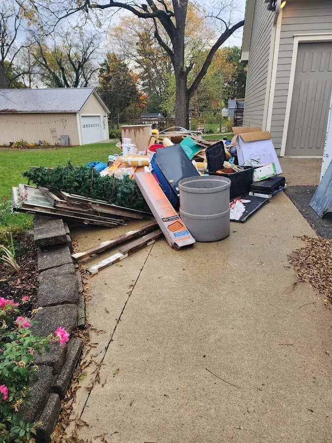 Dumpster being loaded with debris for Commercial Dumpster Rental in Johnstown